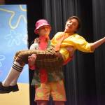 Oliver Parrish portraying Patrick Star, lifts Jackson Hooper as SpongeBob during a rehearsal of SpongeBob SquarePants on Saturday, April 15, 2023, at Nikiski Middle/High School in Nikiski, Alaska. (Jake Dye/Peninsula Clarion)