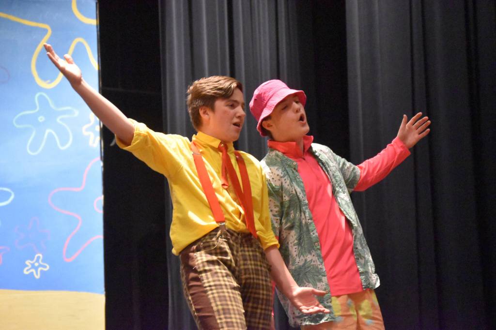 Jackson Hooper portrays SpongeBob SquarePants alongside Oliver Parrish as Patrick during a rehearsal of SpongeBob SquarePants on Saturday, April 15, 2023, at Nikiski Middle/High School in Nikiski, Alaska. (Jake Dye/Peninsula Clarion)