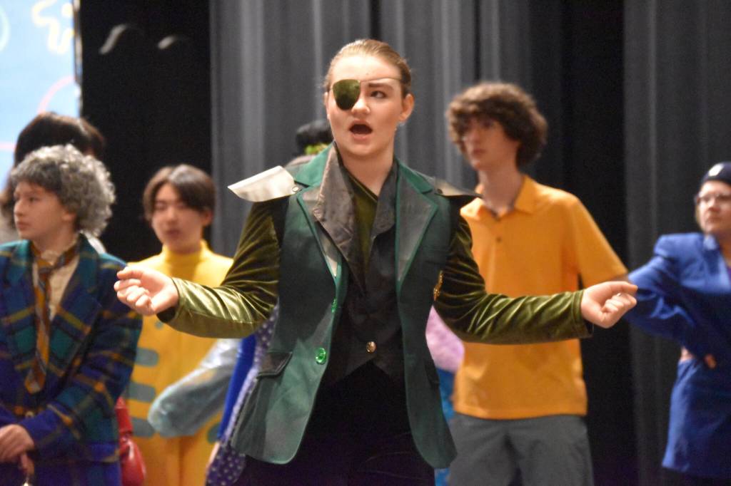 Oshie Broussard, as Plankton, sings during a rehearsal of SpongeBob SquarePants on Saturday, April 15, 2023, at Nikiski Middle/High School in Nikiski, Alaska. (Jake Dye/Peninsula Clarion)