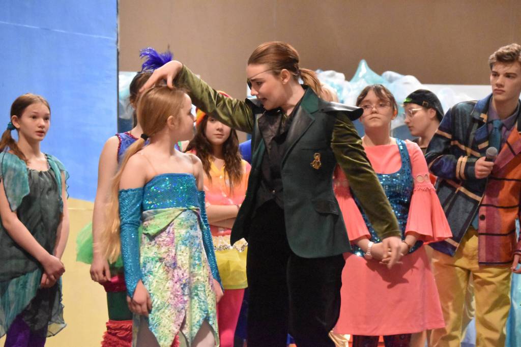 Oshie Broussard, as Plankton, threatens a sardine played by Morgan Hooper during a rehearsal of SpongeBob SquarePants on Saturday, April 15, 2023, at Nikiski Middle/High School in Nikiski, Alaska. (Jake Dye/Peninsula Clarion)