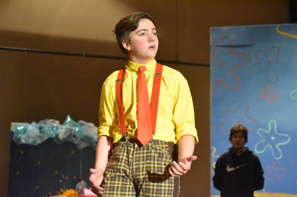 Jackson Hooper portrays SpongeBob SquarePants during a rehearsal of SpongeBob SquarePants on Saturday, April 15, 2023, at Nikiski Middle/High School in Nikiski, Alaska. (Jake Dye/Peninsula Clarion)
