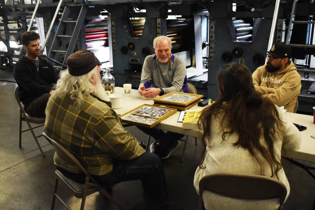 From left, Clarion Sports Editor Jeff Helminiak, former Clarion Production Manager Geoff Long, former Clarion Chief Photographer M. Scott Moon and Clarion Production Director Eric Trevino sit for a roundtable interview with Clarion Government and Education Reporter Ashlyn OHara on Thursday, April 27, 2023. (Jake Dye/Peninsula Clarion)