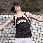 Nikiskis Dalton Goodnight throws the discus Saturday, April 29, 2023, at Ed Hollier Field at Kenai Central High School in Kenai, Alaska. (Photo by Jeff Helminiak/Peninsula Clarion)