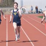 Soldotnas Leigh Tacey II, Homers Lukyan Dax and Kenai Centrals Reagan Graves race in the 200 meters Saturday, April 29, 2023, at Ed Hollier Field at Kenai Central High School in Kenai, Alaska. (Photo by Jeff Helminiak/Peninsula Clarion)