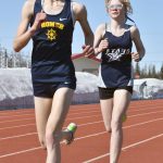 Homers Daisy Walker and Soldotnas Sophia Jedlicki race the 3,200 on Saturday, April 29, 2023, at Ed Hollier Field at Kenai Central High School in Kenai, Alaska. (Photo by Jeff Helminiak/Peninsula Clarion)