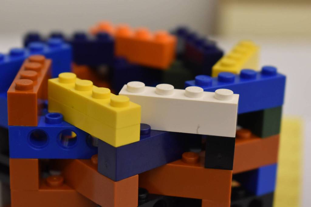 A swirl of colorful bricks make up Lego Kaleidoscope, by Payton M., seen on Friday, April 28, 2023, part of Brick by Brick at the Kenai Community Library in Kenai, Alaska. (Jake Dye/Peninsula Clarion)