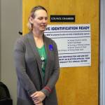 Seward poll worker Vanessa Verhey stands near a ballot tabulator during a special election on Tuesday, May 2, 2023, in Seward City Hall in Seward, Alaska. (Ashlyn OHara/Peninsula Clarion)