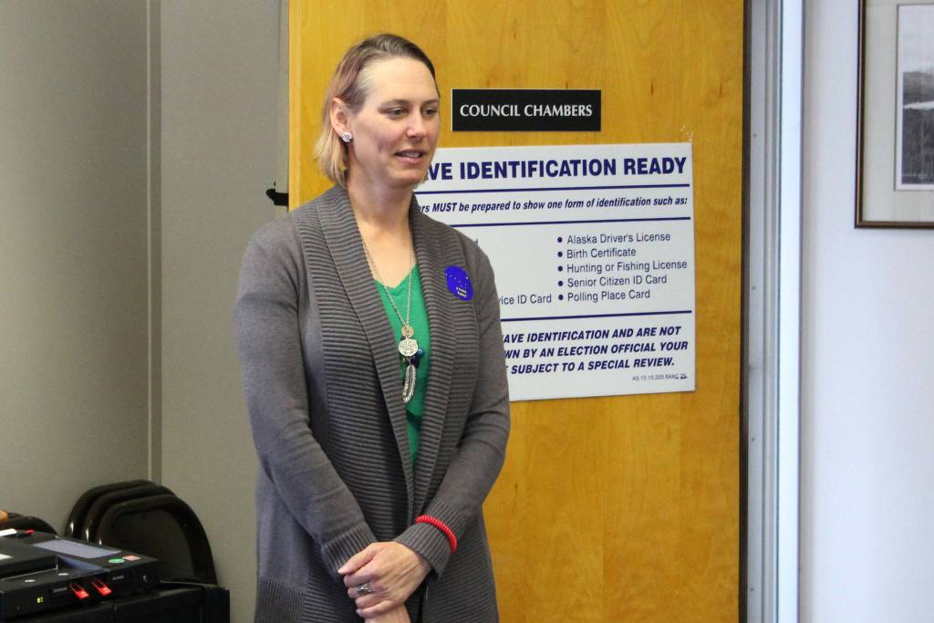 Seward poll worker Vanessa Verhey stands near a ballot tabulator during a special election on Tuesday, May 2, 2023, in Seward City Hall in Seward, Alaska. (Ashlyn OHara/Peninsula Clarion)