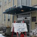 Snow falls on a vote here sign outside of Seward City Hall on Tuesday, May 2, 2023, in Seward, Alaska. Residents voted in a special election to determine whether or not to sell the citys electric utility and to change the citys residency requirements for city manager. (Ashlyn OHara/Peninsula Clarion)