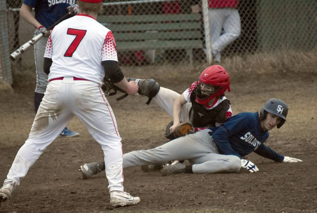 Kenai Central catcher Jayden Sandahl tags out Soldotnas Hunter Harrison on Tuesday, May 2, 2023, at the Kenai Little League Fields in Kenai, Alaska. (Photo by Jeff Helminiak/Peninsula Clarion)