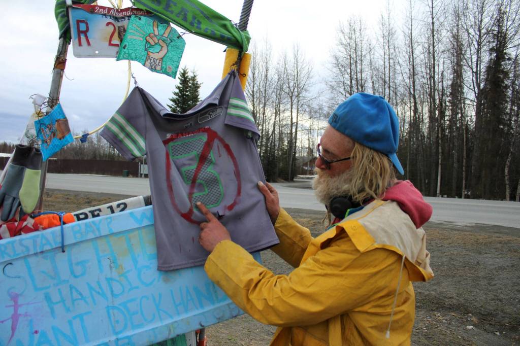 White Rainbow shows off a Russell Wilson jersey affixed to his bik at a gas station on Wednesday, May 3, 2023 near Sterling, Alaska. The 3 was crossed out after Wilson moved to the Denver Broncos. (Ashlyn OHara/Peninsula Clarion)