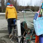 White Rainbow rides his bike at a gas station on Wednesday, May 3, 2023 near Sterling, Alaska. (Ashlyn OHara/Peninsula Clarion)