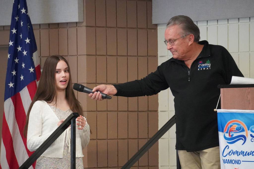 Third Place Winner Laurel Matson, of Cook Inlet Academy, is introduced by Merrill Sikorski at the Caring for the Kenai Awards Celebration held during a Joint Chamber Luncheon on Wednesday, May 3, 2023, at the Soldotna Regional Sports Complex in Soldotna, Alaska. (Jake Dye/Peninsula Clarion)