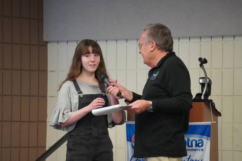 Kiernan Lapp, of Soldotna High School, is introduced by Merrill Sikorski at the Caring for the Kenai Awards Celebration held during a Joint Chamber Luncheon on Wednesday, May 3, 2023, at the Soldotna Regional Sports Complex in Soldotna, Alaska. (Jake Dye/Peninsula Clarion)
