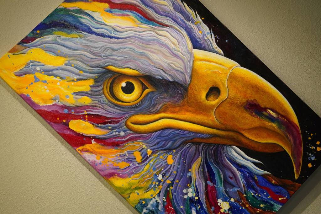 A vibrant painting of an eagle by artist Nathan Perry hangs as part of Elaborate Expressions at the Kenai Art Center in Kenai, Alaska on May 3, 2023. (Jake Dye/Peninsula Clarion)