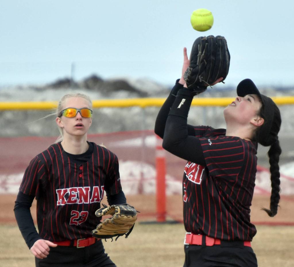 Kenai Central second baseman Kailey Stynsberg makes the catch in front of shortstop Zoey Riley on Thursday, May 4, 2023, at Steve Shearer Memorial Ball Park in Kenai, Alaska. (Photo by Jeff Helminiak/Peninsula Clarion)