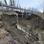 A broken culvert is twisted beneath Funny River Road on Friday, May 5, 2023, near Soldotna, Alaska. (Photo via Kenai Peninsula Borough Office of Emergency Management)