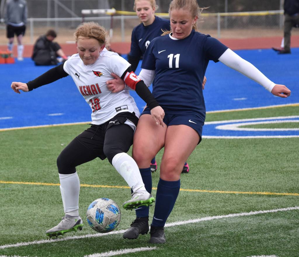 Kenai Centrals Kylee Verkuilen and Soldotnas Sadie Lane battle for the ball Monday, May 8, 2023, at Justin Maile Field at Soldotna High School in Soldotna, Alaska. (Photo by Jeff Helminiak/Peninsula Clarion)