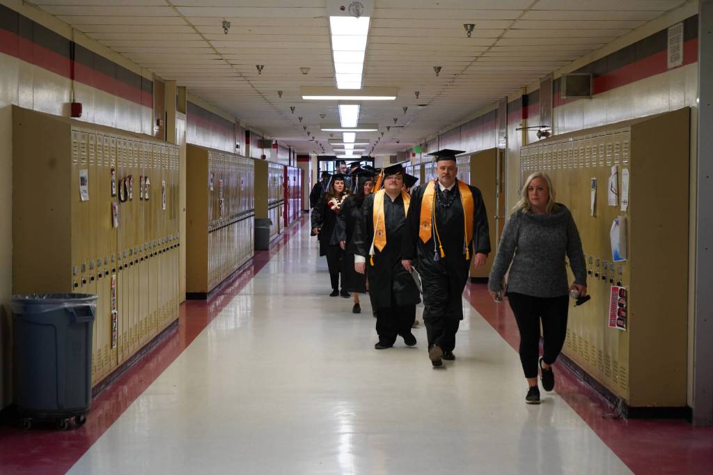 Kenai Peninsula College graduates proceed into the Renee C. Henderson Auditorium for Kenai Peninsula Colleges 53rd annual commencement on Thursday, May 11, 2023, in Kenai, Alaska. (Jake Dye/Peninsula Clarion)