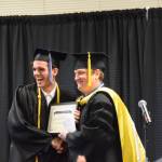 Kachemak Bay Campus Assistant Professor of History Dr. Jeff Meyers (right) presents the KBC Staff Choice award to Jonathan Rozeboom (left) during the 2023 KBC Commencement on Wednesday, May 10, 2023, in Homer, Alaska. (Photo by Delcenia Cosman/Homer News)