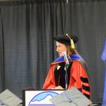 Kachemak Bay Campus Associate Professor of English Dr. Lia Calhoun gives her faculty reflection address during the 2023 KBC Commencement on Wednesday, May 10, 2023, in Homer, Alaska. (Photo by Delcenia Cosman/Homer News)