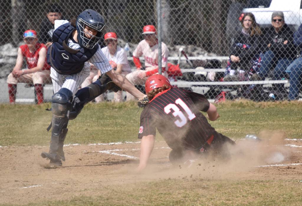 Soldotna catcher Ari Miller tags out Wasillas Whalen Halverson at the plate Saturday, May 13, 2023, at the Soldotna Little League fields in Soldotna, Alaska. (Photo by Jeff Helminiak/Peninsula Clarion)