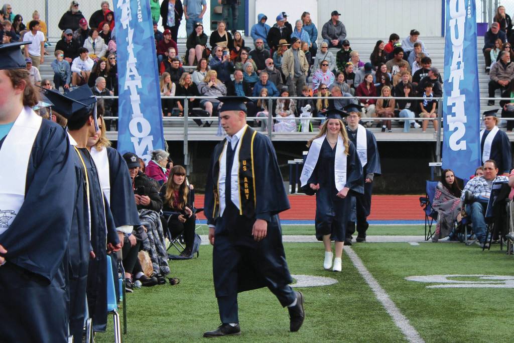 Ashlyn OHara/Peninsula Clarion
Graduates walk in to a ceremony at Soldotna High School on Monday.