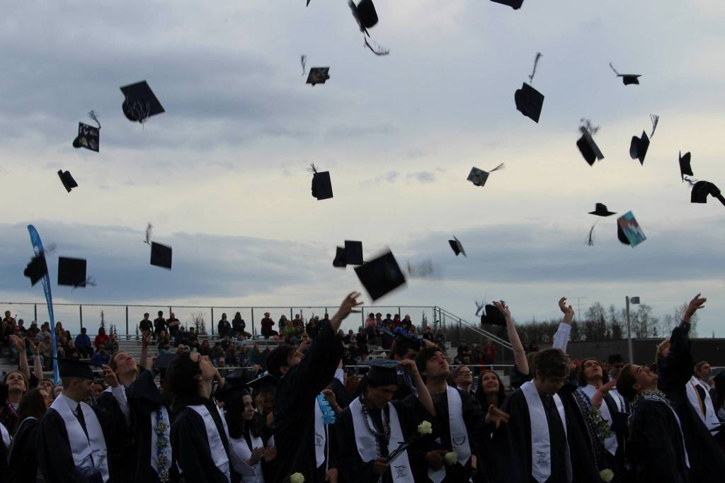 Soldotna High School graduates toss their caps during a ceremony on Monday, May 15, 2023, in Soldotna, Alaska. (Ashlyn OHara/Peninsula Clarion)