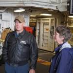 Capt. Matthew Hall leads Seward Mayor Sue McClure on a tour of the USS Zumwalt in Seward, Alaska, on Friday, May 12, 2023. (Jake Dye/Peninsula Clarion)