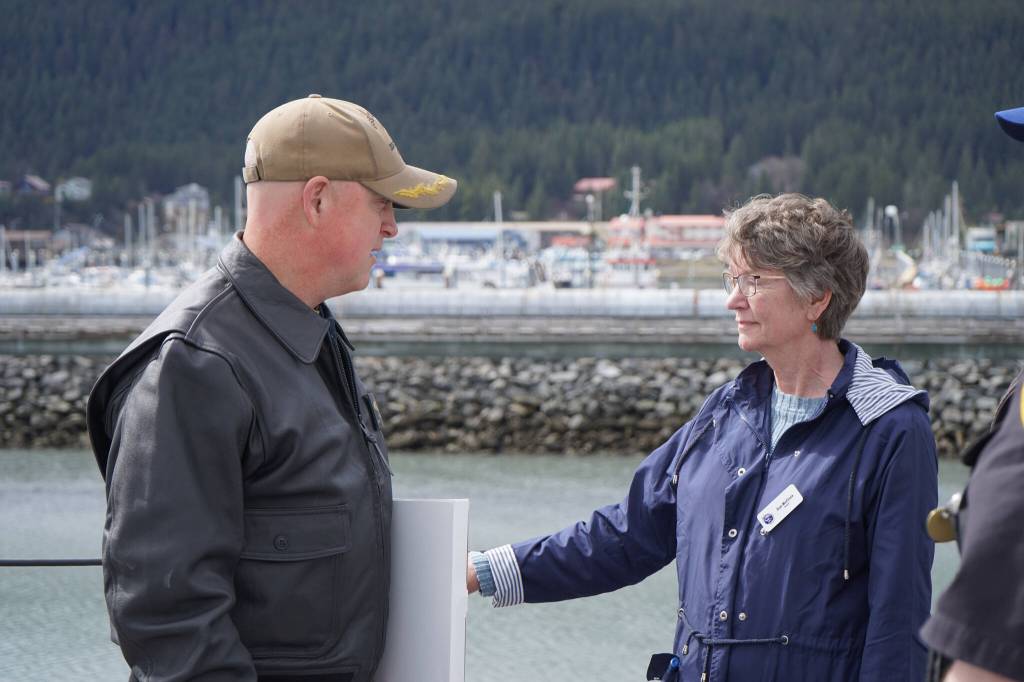 Capt. Matthew Hall leads Seward Mayor Sue McClure on a tour of the USS Zumwalt in Seward, Alaska, on Friday, May 12, 2023. (Jake Dye/Peninsula Clarion)
