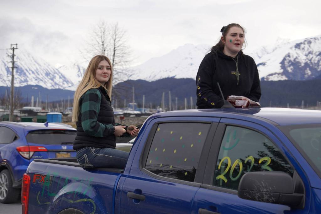 Seward graduates parade down 4th Avenue in Seward, Alaska on Friday, May 12, 2023. (Jake Dye/Peninsula Clarion)