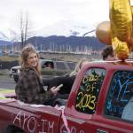 Seward graduate Renee Elhard parades down 4th Avenue in Seward, Alaska on Friday, May 12, 2023. (Jake Dye/Peninsula Clarion)