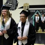 Nikiski Middle/High School graduates Shelby OBrien (left) and Nathan Bourdukofsky (right) file into the gymnasium during their graduation ceremony on Tuesday, May 16, 2023, in Nikiski, Alaska. (Ashlyn OHara/Peninsula Clarion)
