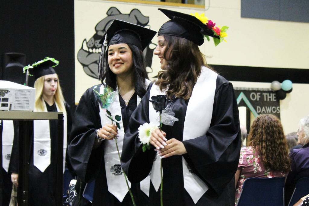 Nikiski Middle/High School graduates present roses to their loved ones during a ceremony on Tuesday, May 16, 2023 in Nikiski, Alaska. (Ashlyn OHara/Peninsula Clarion)