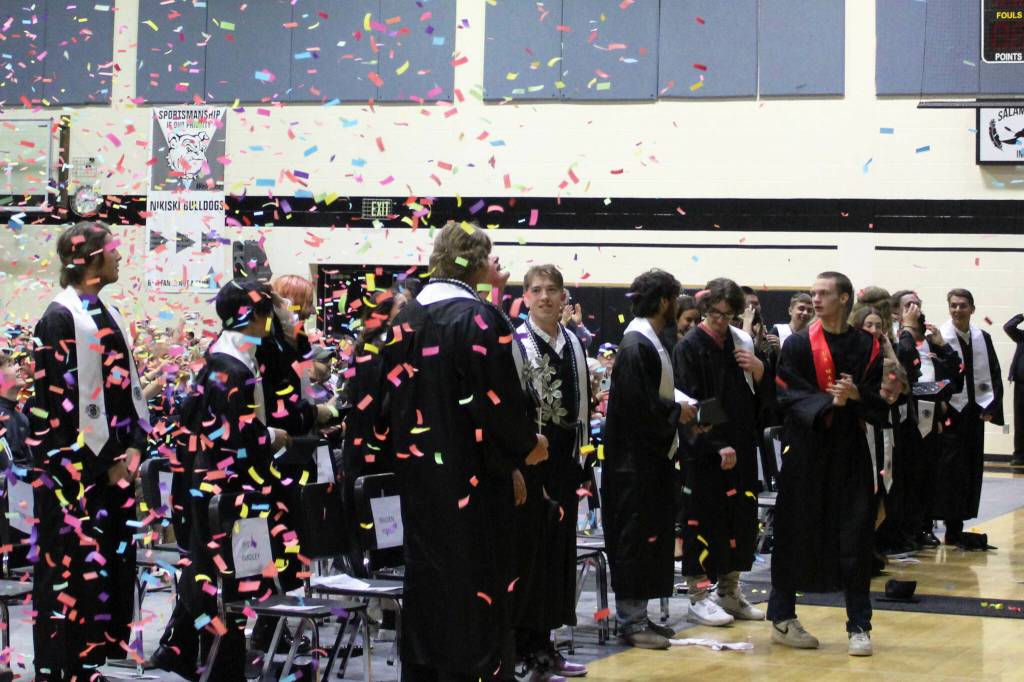 Confetti falls on Nikiski Middle/High School graduates on Tuesday, May 16, 2023, in Nikiski, Alaska. (Ashlyn OHara/Peninsula Clarion)