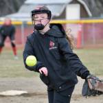 Kenai Central's Lola McEwen delivers to Homer on Tuesday, May 16, 2023, at Steve Shearer Memorial Ball Park in Kenai, Alaska. (Photo by Jeff Helminiak/Peninsula Clarion)