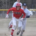 Kenai Centrals Owen Whicker runs away from Soldotna second baseman Trenton Ohnemus on Tuesday, May 16, 2023, at the Soldotna Little League fields in Soldotna, Alaska. (Photo by Jeff Helminiak/Peninsula Clarion)