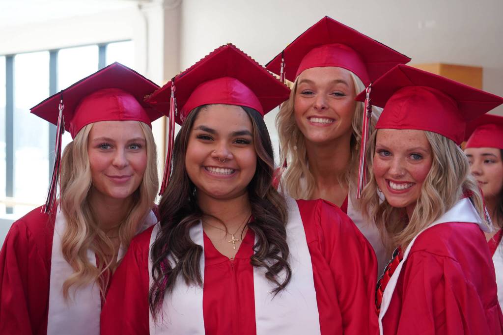 Kenai Central High School graduates prepare to enter the auditorium for their graduation ceremony on Wednesday, May 17, 2023, at Kenai Central High School in Kenai, Alaska. (Jake Dye/Peninsula Clarion)