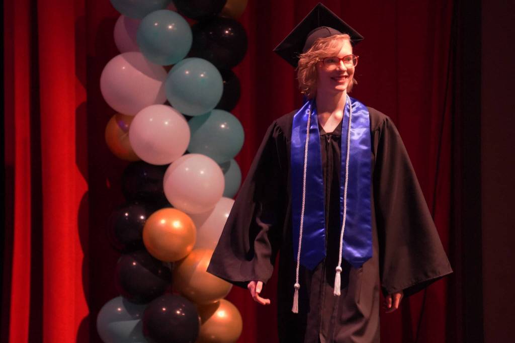 Connections Homeschool students take the stage to receive their diplomas during the Connections Homeschool graduation ceremony on Thursday, May 18, 2023, at Soldotna High School in Soldotna, Alaska. (Jake Dye/Peninsula Clarion)