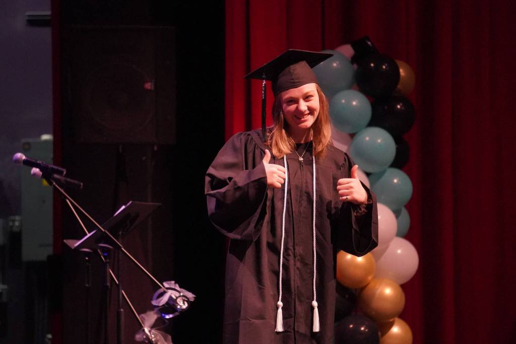 Connections Homeschool students take the stage to receive their diplomas during the Connections Homeschool graduation ceremony on Thursday, May 18, 2023, at Soldotna High School in Soldotna, Alaska. (Jake Dye/Peninsula Clarion)