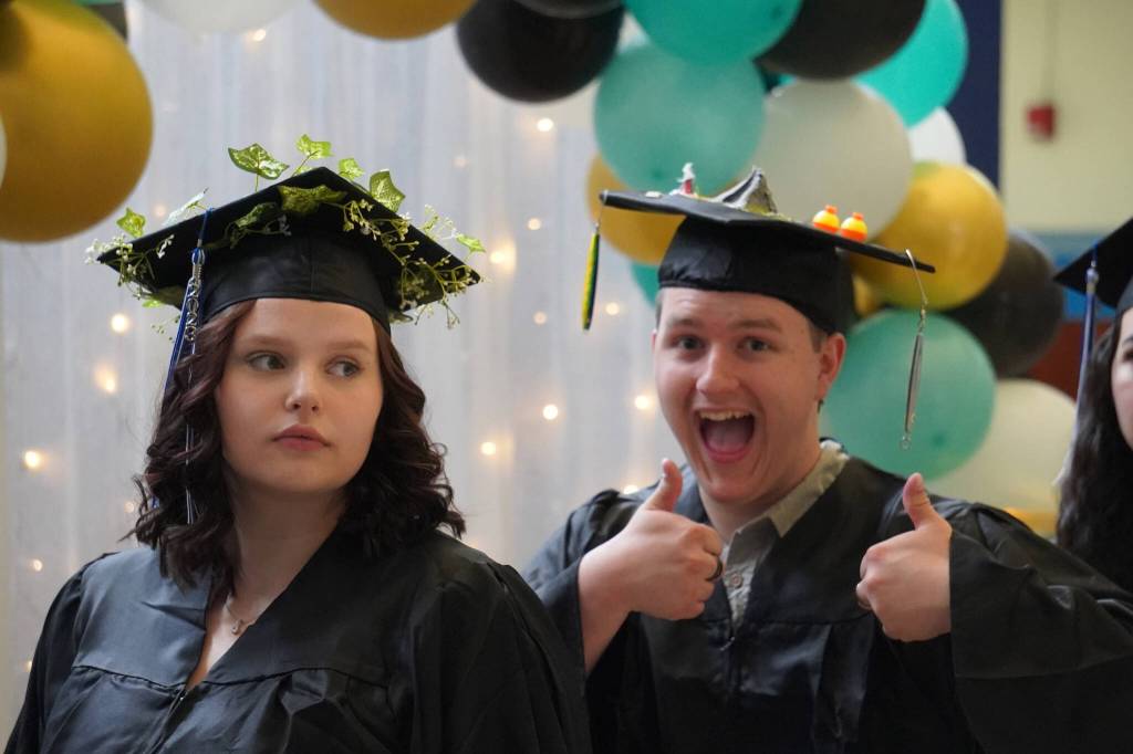 Connections Homeschool students prepare to enter the auditorium ahead of the Connections Homeschool graduation ceremony on Thursday, May 18, 2023, at Soldotna High School in Soldotna, Alaska. (Jake Dye/Peninsula Clarion)