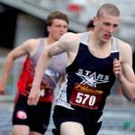 Soldotnas James Innes runs just ahead of Wasillas Tim Grisso in the boys 400 meters during the preliminaries of the Region 3 track and field meet Friday, May 19, 2023, at Palmer High School in Palmer, Alaska. (Jeremiah Bartz/Frontiersman)