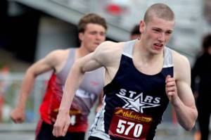 Soldotna’s James Innes runs just ahead of Wasilla’s Tim Grisso in the boys 400 meters during the preliminaries of the Region 3 track and field meet Friday, May 19, 2023, at Palmer High School in Palmer, Alaska. (Jeremiah Bartz/Frontiersman)