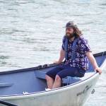 Contestants celebrate after completing the 16th Annual Cooper Landing Drift Boat Regatta at Sportsmans Landing in Cooper Landing, Alaska, on Saturday, May 20, 2023. (Jake Dye/Peninsula Clarion)