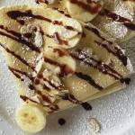 The simple yet versatile crepe can be served savory or sweet, such as this banana, powdered sugar and chocolate creation. (Photo by Tressa Dale/Peninsula Clarion)