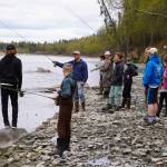 Dave Atcheson demonstrates fly casting into the Kenai River to a crowd of middle schoolers during a kids camp put on by Trout Unlimited on Wednesday, May 24, 2023, at the Donald E. Gilman Kenai River Center in Soldotna, Alaska. (Jake Dye/Peninsula Clarion)