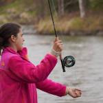Aviana Stroh practices fly casting into the Kenai River during a kids camp put on by Trout Unlimited on Wednesday, May 24, 2023, at the Donald E. Gilman Kenai River Center in Soldotna, Alaska. (Jake Dye/Peninsula Clarion)
