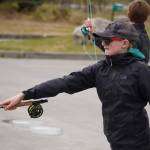 Middle schoolers practice fly casting in the parking lot of the Donald E. Gilman Kenai River Center in Soldotna, Alaska, during a kids camp put on by Trout Unlimited on Wednesday, May 24, 2023. (Jake Dye/Peninsula Clarion)