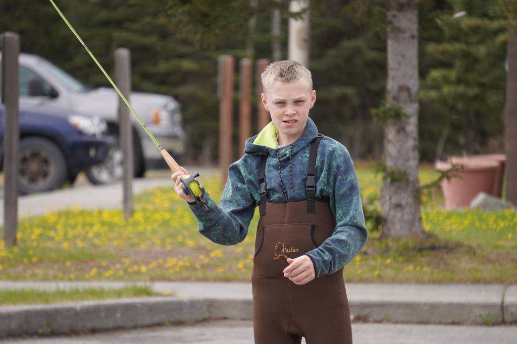 Middle schoolers practice fly casting in the parking lot of the Donald E. Gilman Kenai River Center in Soldotna, Alaska, during a kids camp put on by Trout Unlimited on Wednesday, May 24, 2023. (Jake Dye/Peninsula Clarion)