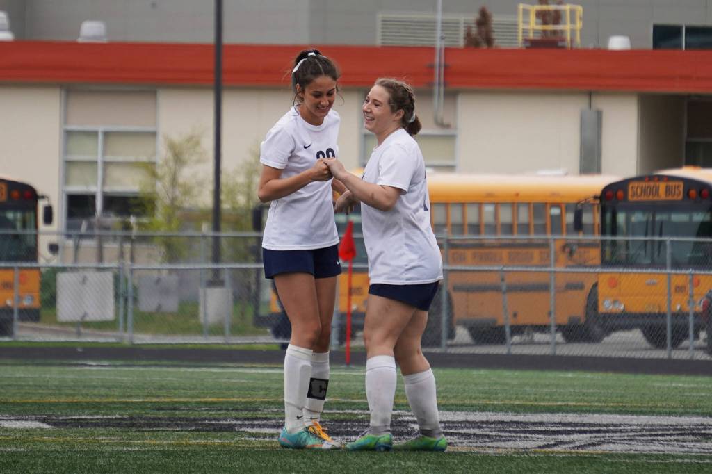 Soldotnas Zayra Poage and Liberty Miller celebrate after Miller scored a goal during the Division II Soccer State Championship on Saturday, May 27, 2023, at West Anchorage High School in Anchorage, Alaska. (Jake Dye/Peninsula Clarion)